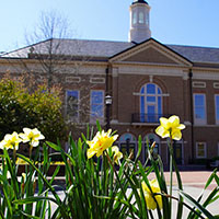 Exterior of Mill Hall with flowers