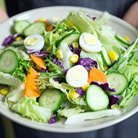 Person holding salad