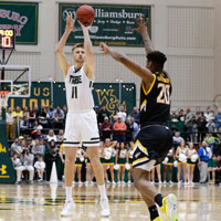 Andy Van Vliet shoots the basketball over an opposing defender
