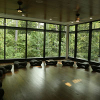 Interior of McLeod Tyler Wellness Center with low seats on dark hardwood floor