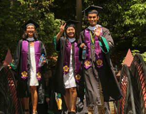 Graduates walk across the Crim Dell. (Photo by Stephen Salpukas) 