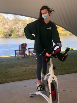 Campus Recreation instructor Kamila Mehdi ’21 leads a cycling class at the Martha Wren Briggs Amphitheatre at Lake Matoaka. Photo courtesy of Kamila Mehdi