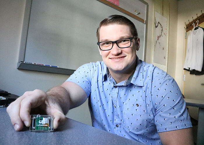 Ken Koltermann is a third-year Ph.D. candidate in computer science at William & 玛丽. He is part of a team of researchers working to develop a novel treatment for a symptom of Parkinson’s disease called Freezing of Gait. (Photo by Adrienne Berard)
