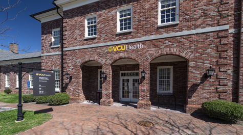 A brick building with a sign that says VCU Health