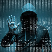 A person whose face can't be seen stands behind a wall of numbers with their hand raised