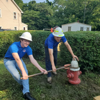 W&M student helping test fire hydrants