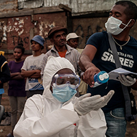 People in Madagascar line up at a COVID testing site