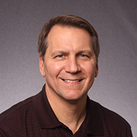 Portrait photograph of Michael Deschenes