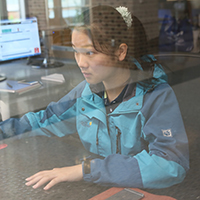 Student analyzing data at a computer