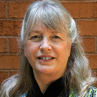Portrait photographs of two faculty members 