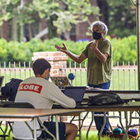 A class meets for a lecture in an outdoor learning space 