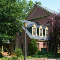 The Reves Center nestled among several trees