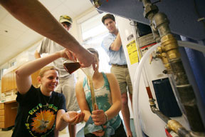 (From left) Clare Stankwitz, Chelsea Estancona, Andy Allen and Matthew Ryan process fuel. By Stephen Salpukas.