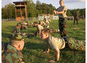 Photo: William and 玛丽 ROTC Cadet Stephen Draheim (front doing push-ups) and Cadet Jennifer Purser (standing) participate in last year's Ranger Challenge Competition. By Maj. Don Caughey.