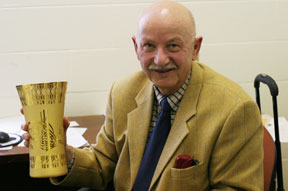 Bechtold holds one of the numerous awards he has received for foreign service. By David Williard. Bechtold holds one of the numerous awards he has received for foreign service. By David Williard.