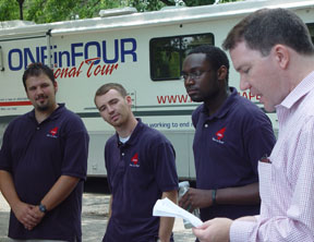 William and 玛丽 alumns James Ambrose (R) and J.T. Newbury (center) listen with fellow tour member Dan Mollison as Prof. John Foubert sends them off with words of encouragement. By Suzanne Seurrattan.