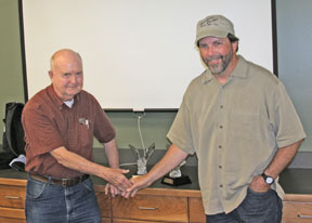 Mitchell Byrd (l) exchanges congratulations with Bryan Watts. 