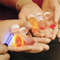 Hands holding vials
