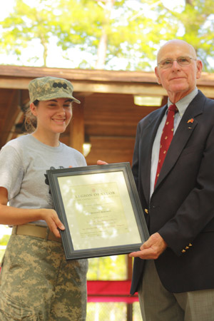 Kirsten Bertsch '10 receives the Legion of Valor Bronze Cross for Achievement from Retired Marine Brig. Gen. Edwin Kelley. (Courtesy photo)