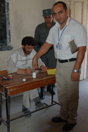 The interpreter for Mullen's group votes in Kabul. 