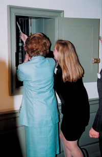 Thatcher rings the Wren Bell as an honoary member of the Class of 2001.