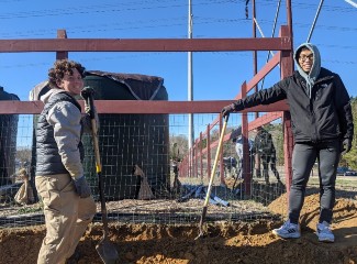 student volunteers at community garden