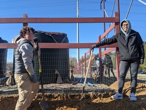 Volunteers working at garden fence
