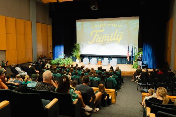The Family Weekend logo projected on a screen in a lecture hall