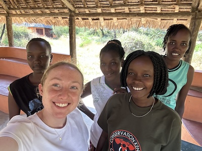 W&M student Corinne Boyd (front left) and SORALO researcher Cynthia Kileken (front right) enjoy a day off with the SORALO women rangers. PHOTO: Corinne Boyd