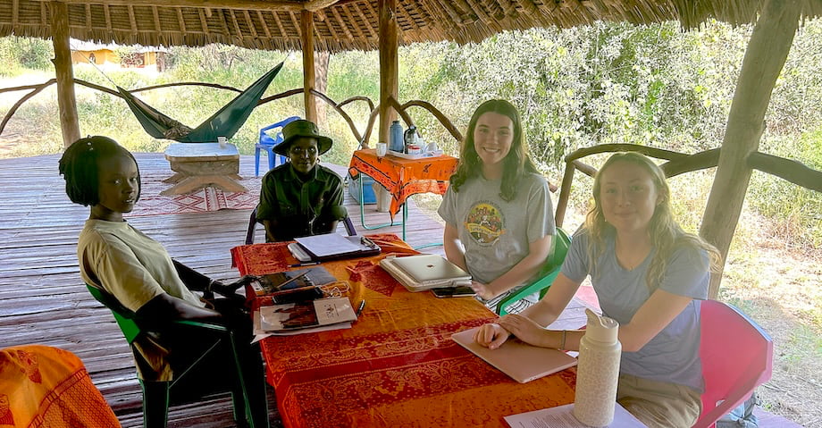 W&M students Jana Smith-Perry '26 (center right) and Corinne Boyd '26 (right) meet with SORALO researcher Cynthia Kileken (left) and SORALO ranger in training, Rose Dapana (center left).  PHOTO: Erica Garroutte