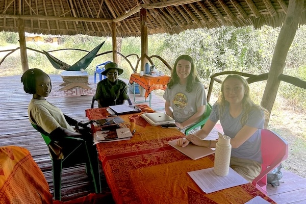 Students and Rangers sitting at table