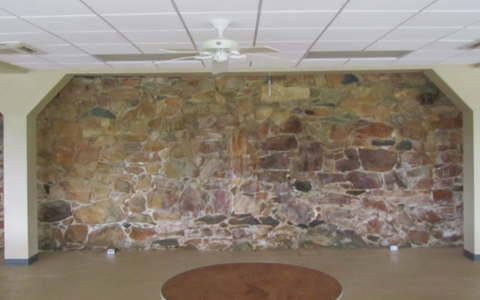 A before picture of the wall on which a projector has now been mounted.