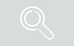 A white outline of a magnifying glass over a gray background